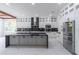 Modern kitchen features an island, stainless steel appliances, and marble countertops at 140 Maranatha Trl, Lawrenceville, GA 30045