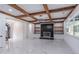 Bright open-concept living space with marble floors, a modern fireplace, and coffered ceilings at 140 Maranatha Trl, Lawrenceville, GA 30045