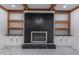 Stylish fireplace with custom shelving and marble accents at 140 Maranatha Trl, Lawrenceville, GA 30045