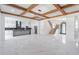 Expansive living space showcasing marble floors, a staircase, and a kitchen with modern appliances at 140 Maranatha Trl, Lawrenceville, GA 30045