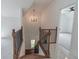 Staircase with wooden steps and black iron railings at 140 Maranatha Trl, Lawrenceville, GA 30045