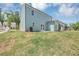 Spacious backyard with lawn area showcasing the home's exterior and outdoor living space at 212 Birchwood Row, Canton, GA 30115