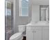 Modern bathroom with double sink vanity, toilet, and glass enclosed shower at 212 Birchwood Row, Canton, GA 30115