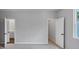 Spacious bedroom with doorways leading to the bathroom and closet at 212 Birchwood Row, Canton, GA 30115
