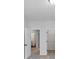 Light-filled bedroom with multiple doorways for easy access to the hallway and closet at 212 Birchwood Row, Canton, GA 30115