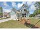 Lovely light blue home with manicured front lawn at 212 Birchwood Row, Canton, GA 30115