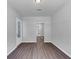 Open-concept living room with modern hardwood flooring and a view to other rooms of the house at 212 Birchwood Row, Canton, GA 30115