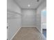 Spacious walk-in closet with carpeted floor and wire shelving at 212 Birchwood Row, Canton, GA 30115