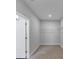 Walk-in closet complete with shelving and a neutral colored carpet at 212 Birchwood Row, Canton, GA 30115