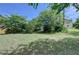Large grassy backyard surrounded by mature trees, offering a private outdoor space at 25 Kaktovic Ct, Grayson, GA 30017