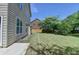 Spacious backyard with green grass and lush trees providing privacy and shade at 25 Kaktovic Ct, Grayson, GA 30017