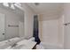 Bathroom with a shower and tub combination and a vanity with a large mirror at 25 Kaktovic Ct, Grayson, GA 30017