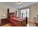 Elegant bedroom with a luxurious bed, hardwood floors, and natural light at 25 Kaktovic Ct, Grayson, GA 30017
