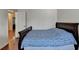 Bedroom featuring wood floors, a bed, and a doorway leading to another room at 25 Kaktovic Ct, Grayson, GA 30017