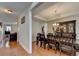 Elegant dining room featuring hardwood floors, a decorative hutch, and access to other rooms at 25 Kaktovic Ct, Grayson, GA 30017