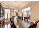 Formal dining room featuring hardwood floors, coffered ceiling and a dark wood hutch at 25 Kaktovic Ct, Grayson, GA 30017