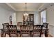 Formal dining room featuring a dark wood table, hutch, and detailed trim work at 25 Kaktovic Ct, Grayson, GA 30017