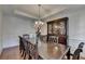 Spacious dining room featuring hardwood floors and a large dark wood table at 25 Kaktovic Ct, Grayson, GA 30017