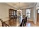 Dining room with hardwood floors, coffered ceilings, and a dark wood hutch at 25 Kaktovic Ct, Grayson, GA 30017