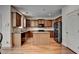 Bright kitchen with granite countertops, wooden cabinets and stainless steel appliances at 25 Kaktovic Ct, Grayson, GA 30017