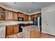 Well-lit kitchen featuring wooden cabinets, granite countertops, a kitchen island, and stainless steel appliances at 25 Kaktovic Ct, Grayson, GA 30017