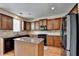 Modern kitchen features stainless steel appliances, granite countertops, and wood cabinets at 25 Kaktovic Ct, Grayson, GA 30017