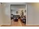 Comfortable living room featuring hardwood floors, a treadmill, and cozy furnishings at 25 Kaktovic Ct, Grayson, GA 30017