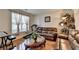 Comfortable living room featuring hardwood floors, a treadmill, and cozy furnishings at 25 Kaktovic Ct, Grayson, GA 30017