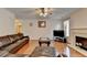 Bright living room with a cozy fireplace and a comfortable leather sectional at 25 Kaktovic Ct, Grayson, GA 30017