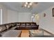Bright and airy living room showcasing a large brown sectional at 25 Kaktovic Ct, Grayson, GA 30017