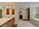 This spacious main bathroom features a double sink vanity, glass shower, and large soaking tub at 25 Kaktovic Ct, Grayson, GA 30017