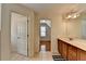 This main bathroom features a double sink vanity with wood cabinets and tiled floors at 25 Kaktovic Ct, Grayson, GA 30017