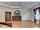 This main bedroom boasts hardwood floors, a dark wood dresser, and natural light at 25 Kaktovic Ct, Grayson, GA 30017