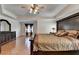 Spacious main bedroom featuring hardwood floors, a dresser, and stylish furnishings at 25 Kaktovic Ct, Grayson, GA 30017