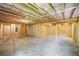 Unfinished basement with wooden framing and concrete floor, offering potential for customization at 2714 Eagles Crest Ln, Decatur, GA 30034