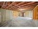 Spacious unfinished basement area featuring open ceiling, concrete floors and wooden framing at 2714 Eagles Crest Ln, Decatur, GA 30034