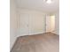 Neutral bedroom with carpet floors and two doors at 2714 Eagles Crest Ln, Decatur, GA 30034