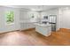 Modern kitchen with white cabinetry, stainless steel appliances, and center island with sink at 2714 Eagles Crest Ln, Decatur, GA 30034