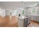 Bright open kitchen featuring a central island with sink, stainless dishwasher, and views to the living area at 2714 Eagles Crest Ln, Decatur, GA 30034