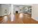Spacious open-concept living area featuring gleaming hardwood floors, a cozy fireplace and lots of natural light at 2714 Eagles Crest Ln, Decatur, GA 30034