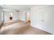 Spacious primary bedroom with carpet, ceiling fan, closet and door to bathroom at 2714 Eagles Crest Ln, Decatur, GA 30034