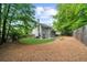 Expansive backyard showing well-maintained lawn and treelined perimeter for privacy at 2865 Ivey Oaks Ln, Roswell, GA 30076