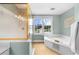 Modern bathroom featuring a shower, soaking tub, and bright windows at 2865 Ivey Oaks Ln, Roswell, GA 30076