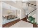 Open foyer showcasing staircase and entry to the dining room, with beautiful hardwood floors at 2865 Ivey Oaks Ln, Roswell, GA 30076