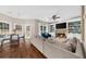 Open floor plan showing the living room with cozy fireplace, TV, and view to the kitchen at 2865 Ivey Oaks Ln, Roswell, GA 30076