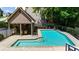Community pool and attached spa with lounge chairs and shaded seating area at 2865 Ivey Oaks Ln, Roswell, GA 30076