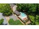 Aerial view of community pool area with lounge chairs and mature trees at 2865 Ivey Oaks Ln, Roswell, GA 30076