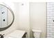 Bathroom featuring subway tile shower, modern vanity and round mirror at 600 Ponderosa Ct, Fayetteville, GA 30214