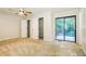 Bright bedroom with neutral carpet, ceiling fan, dual closets, and sliding glass doors to deck at 600 Ponderosa Ct, Fayetteville, GA 30214