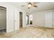 Bright bedroom features a ceiling fan, neutral carpet and has a bathroom located near the closet at 600 Ponderosa Ct, Fayetteville, GA 30214